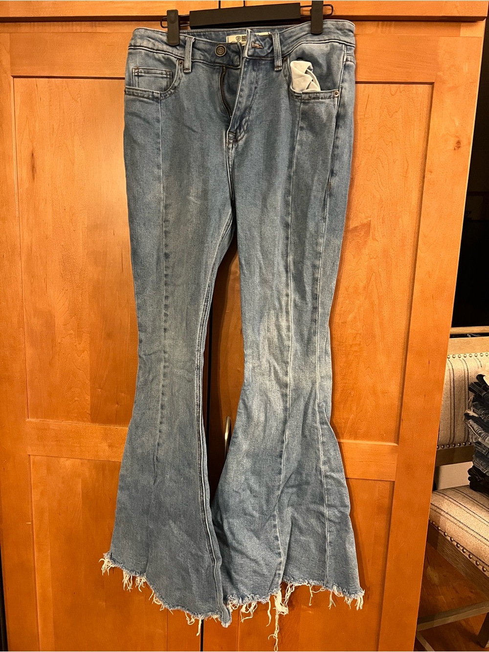 High-Rise Light Blue Flare Jeans with Raw Hem